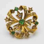 A diamond and emerald set brooch, set in gold (no hallmark), approx 3.8g, 23mm.