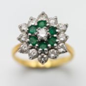 A diamond and emerald cluster ring, set in 18ct gold (hallmark rubbed), size J, approx 4.6g.