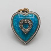 A heart shaped pendant set with blue enamel and diamonds, approx 2.9g.