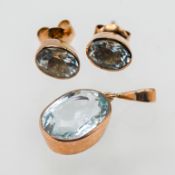 A 9ct gold aquamarine pendant together with a pair gold and aquamarine studs (not hallmarked).