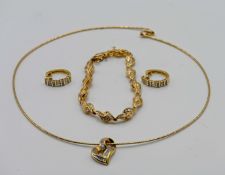 An 18ct yellow gold and diamond jewellery set to include earrings, necklace and bracelet, total