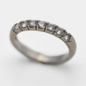 A seven stone diamond half eternity ring, set in platinum, size H/I, approx weight 3.7g.
