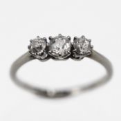 A three stone diamond set ring, set in 18ct white gold and platinum, size N, approx 2.1g.