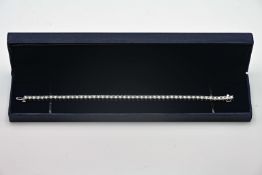 A fine diamond set line bracelet, set in 18ct white gold, with forty nine diamonds, approx 5.64ct,