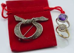 A 9ct gold ring together with a silver dress and brooch.