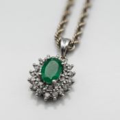 A diamond and emerald necklace, set in 18ct white gold, approx 5.1g.