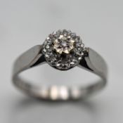 A diamond cluster ring, set in 9ct white gold, size N/O, approx 2.9g.