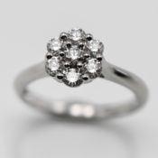 A diamond 'Daisy' style cluster ring, set in platinum, size L, approx 4.3g.