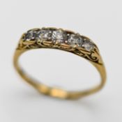 A five stone diamond ring, set in 18ct yellow gold, size V, approx 3.3g.