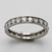 A full diamond eternity ring, set in white metal (not hallmarked), size N, approx 3.7g.