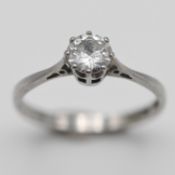 A platinum diamond solitaire ring, size M, marked inside TB7516, approx 2.3g.
