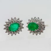 A pair of diamond and emerald studs, set in 18ct white gold, approx 4.3g.