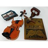 A collection of various items and pictures, to include a violin, stereoscopic viewer and cards, pair