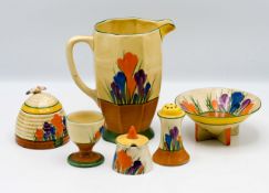 Various Clarice Cliff pieces in the 'Crocus' pattern, to include jug, bowl, egg cup, mustard pots,