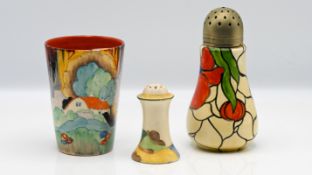 A Clarice Cliff 'Forest Glen' pattern cup, together with a 'Muffineer' shape pepper shaker, and a '