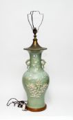 A large slip decorated celadon vase, 18th/19th century, of baluster from, decorated with birds