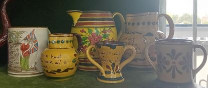 A quantity of Aller Vale motto ware jugs and other pieces, together with a Brittania mug, various