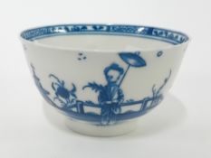 An 18th century tea bowl, 's' mark to base, probably for Caughley, painted in blue with a Chinese