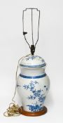 A large blue and white jar and cover, 19th century, finely painted with exotic birds amongst