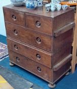 A Victorian two section chest fitted with two short and three long drawers on bun feet, of