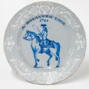 An 18th century Bristol Delft bianco sopra bianco plate, decorated with man on horseback