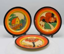 Three Clarice Cliff plates, to include 'Orange Roof Cottage' pattern, 'Trees and House' pattern, and