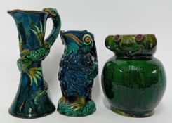 Two Devon ware vases, decorated as birds and lizards, together with a vase signed to base 'Baron