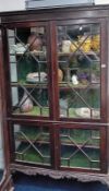 An early 20th century mahogany display cabinet fitted with two upper and two lower astragal glazed