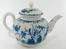 An 18th century porcelain teapot and cover, probably First Period Worcester, with crescent moon to