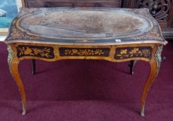A 19th century marquetry inlaid and gilt mounted writing table, fitted with a single full length