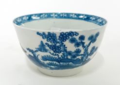 An 18th century porcelain tea bowl, possibly First Period Worcester, marked with a 'W', decorated