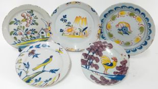 A collection of 18th century tin-glazed earthenware plates, to include five of polychrome floral and