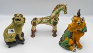 A selection of animal figures comprising; a celadon glazed dog of Fo (wood stand) 18cm overall; a