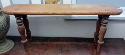 An antique joined oak seat with turned legs. Length 107cm, height 46cm.
