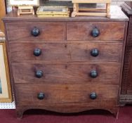 A late Georgian mahogany chest fitted with two short and three long drawers, with inlaid decoration.