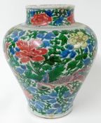 A Wucai jar, Transitional period, 17th century, the ovoid body painted with phoenix within densely