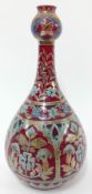 A Zsolnay Pecs Hungary vase, decorated in Persian style floral motifs on red underglaze, height