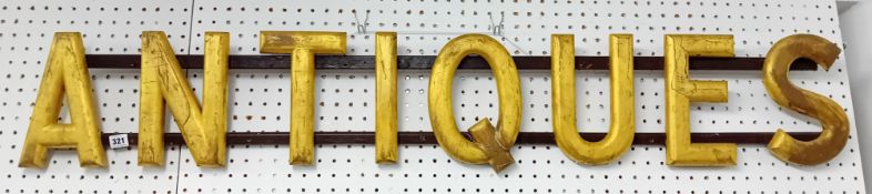 A shop sign 'Antiques' originally from Tony Martin's shop in Fore Street, Looe, width