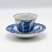 A blue and white Hichozan Shinpo Arita tea bowl and saucer, 19th century, of fluted form,