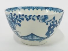 An 18th century porcelain tea bowl, possibly First Period Worcester, decorated with floral motifs to