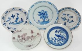 Five English Delftware plates, of mainly blue painted floral and crane bird decoration, and brown