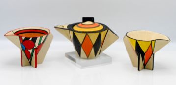 A Clarice Cliff conical teapot, yellow, orange and black diamond pattern, together with milk jug and