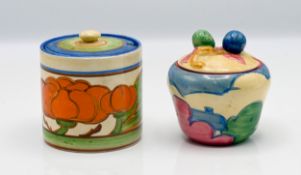 A Clarice Cliff 'Pastel Autumn' preserve pot, together with another in 'Orange Lily' pattern,