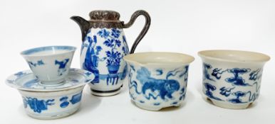 A silver-mounted blue and white ewer and cover, 18th century, the slender ovoid body painted with