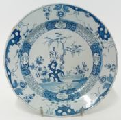 An 18th century English Delftware plate, inscribed 'I.S.E. 1756', decorated with foliate motifs,