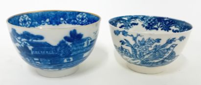 Two 18th century porcelain tea bowls, possibly First Period Worcester, decorated with birds, and