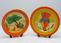A Clarice Cliff 'Windbells' pattern plate, together with another in 'Red Roofs' pattern, Fantasque