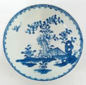 An 18th century porcelain saucer, probably Lowestoft, decorated with floral motifs.
