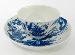 An 18th century porcelain tea bowl and saucer, the bowl marked with crescent, probably First