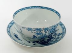 An 18th century porcelain tea bowl and saucer (not a pair), possibly First Period Worcester, the